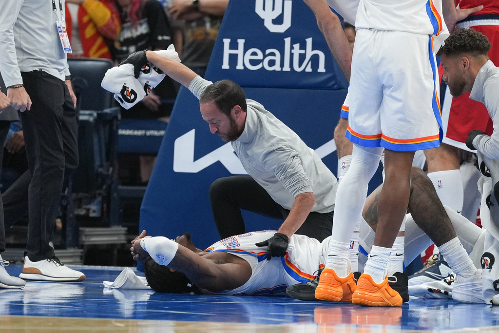 Oklahoma City Thunder guard Jalen Williams is attended to by medical staff during the second half of an NBA basketball game against the Los Angeles Clippers, Sunday, Oct. 25, 2026, in Oklahoma City. (AP Photo/Kyle Phillips)