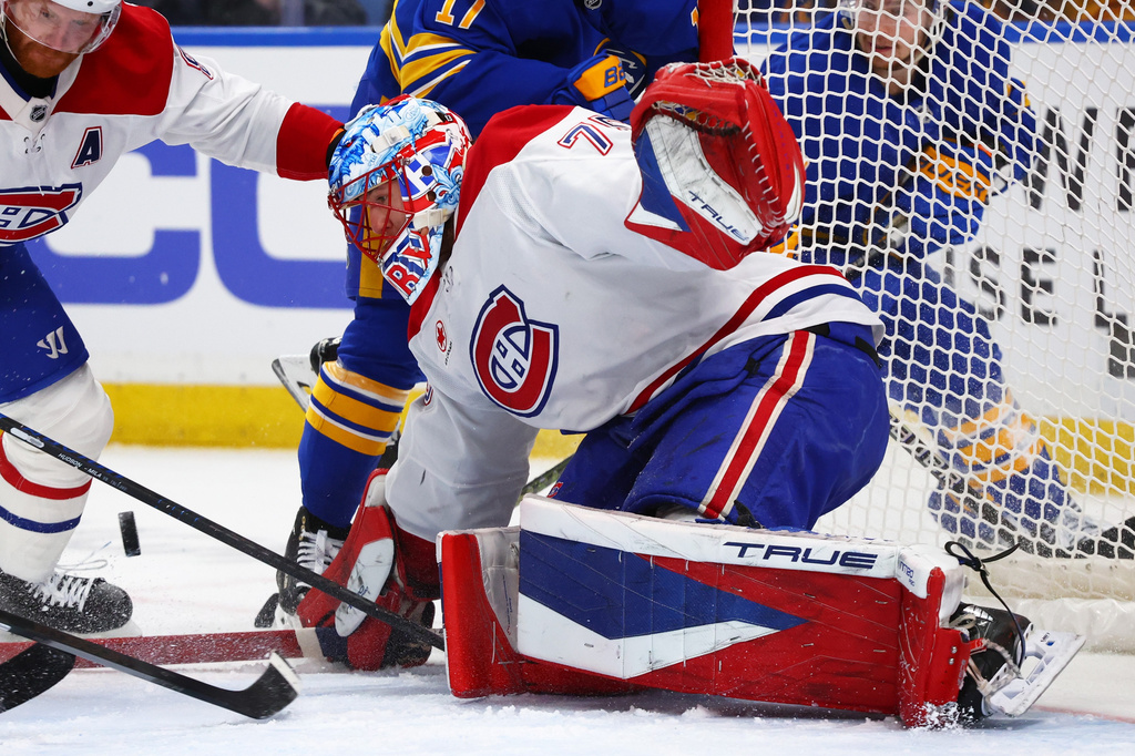 Montreal Canadiens goaltender Jakub Dobes watches the puck in traffic during the first period in Game 5 of a second-round NHL hockey Stanley Cup playoff series against the Buffalo Sabres, Thursday, May 14, 2026, in Buffalo, N.Y. (AP Photo/Jeffrey T. Barnes)