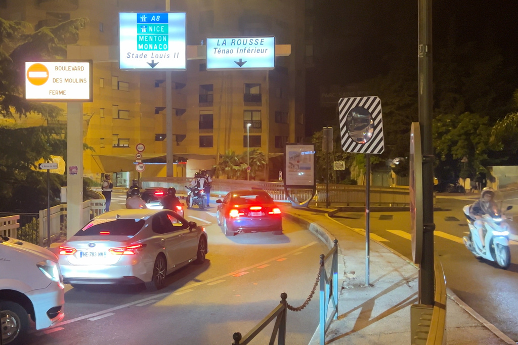 Police stop motorists after a blast from an explosive device injured multiple people at a residential building in Monaco, late Monday, June 29, 2026.. (Clement Lanot via AP)