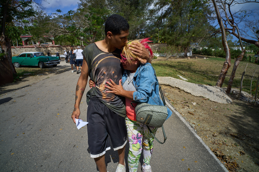 A pardoned prisoner kisses a family member after his release from La Lima penitentiary in Guanabacoa, Havana, Cuba, Friday, April 3, 2026. (AP Photo/Ramon Espinosa)