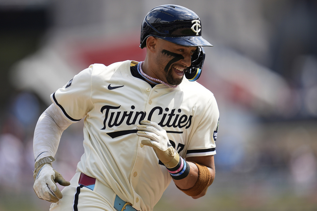 Minnesota Twins' Royce Lewis runs the bases after hitting a solo home run during the second inning of a baseball game against the Detroit Tigers, Sunday, Aug. 17, 2025, in Minneapolis. (AP Photo/Abbie Parr)