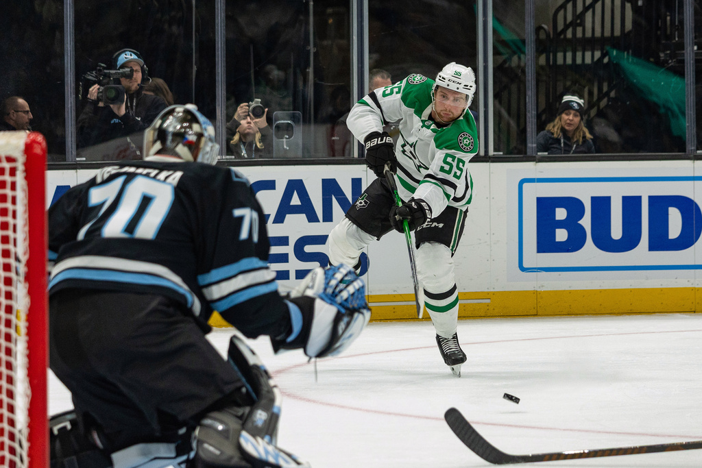 Dallas Stars defenseman Thomas Harley (55) shoots the puck against Utah Mammoth goaltender Karel Vejmelka (70) during the second period of an NHL hockey game Thursday, Jan. 15, 2026, in Salt Lake City. (AP Photo/Melissa Majchrzak)