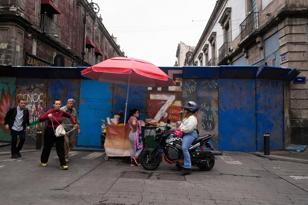 Fences block teachers from setting up camp in the Zocalo as they protest for salary increases in Mexico City, Tuesday, June 9, 2026. (AP Photo/Marco Ugarte)
