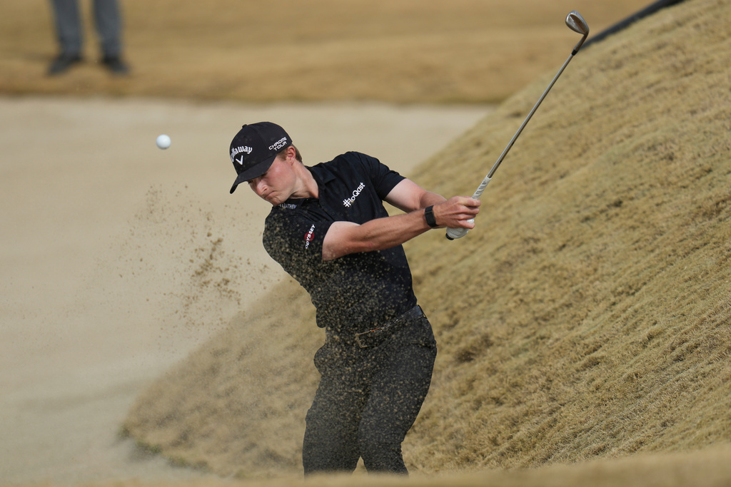 Blades Brown hits out of a bunker at the 8th hole during the final round of the American Express golf event on the Pete Dye Stadium Course at PGA West Sunday, Jan. 25, 2026, in La Quinta, Calif. (AP Photo/Ross D. Franklin)