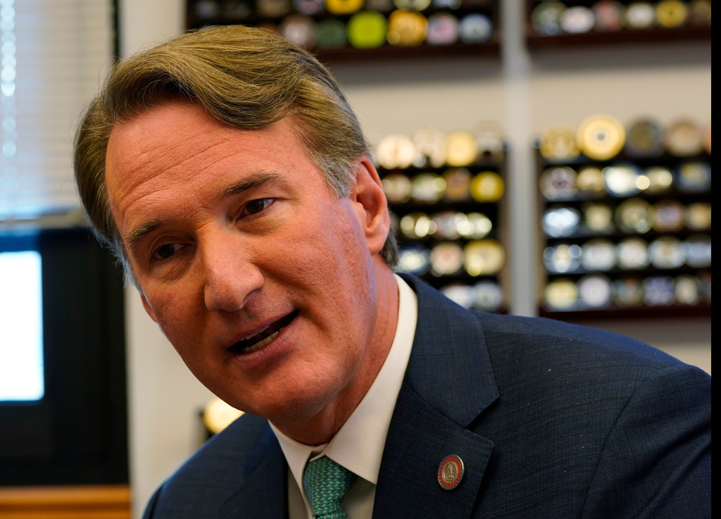Virginia Gov. Glenn Youngkin gestures during an interview in his office at the Capitol Wednesday Dec. 10, 2025, in Richmond, Va. (AP Photo/Steve Helber)