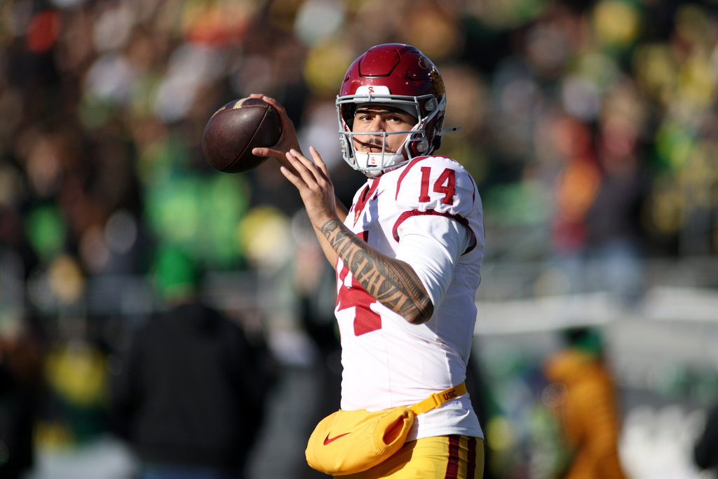 Southern California quarterback Jayden Maiava (14) warms up before an NCAA college football game against Oregon, Saturday, Nov. 22, 2025, in Eugene, Ore. (AP Photo/Lydia Ely)