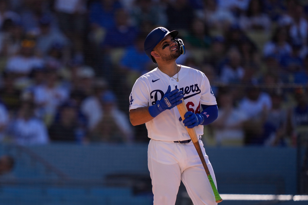 Los Angeles Dodgers' Eliezer Alfonzo looks toward the sky as he steps up to bat during the third inning of a baseball game against the San Diego Padres, Sunday, July 5, 2026, in Los Angeles. (AP Photo/Mark J. Terrill)