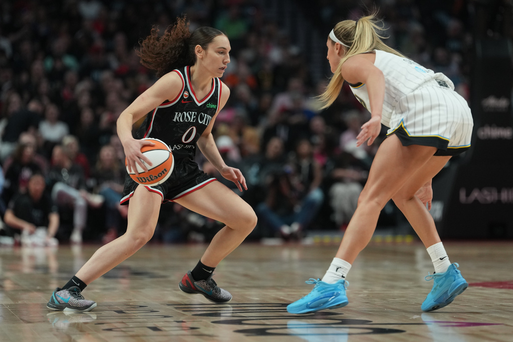 Portland Fire guard Carla Leite (0) looks to go to the basket during the first half of a WNBA basketball game against the Chicago Sky on Saturday, May 9, 2026, in Portland, Ore. (AP Photo/Jenny Kane)