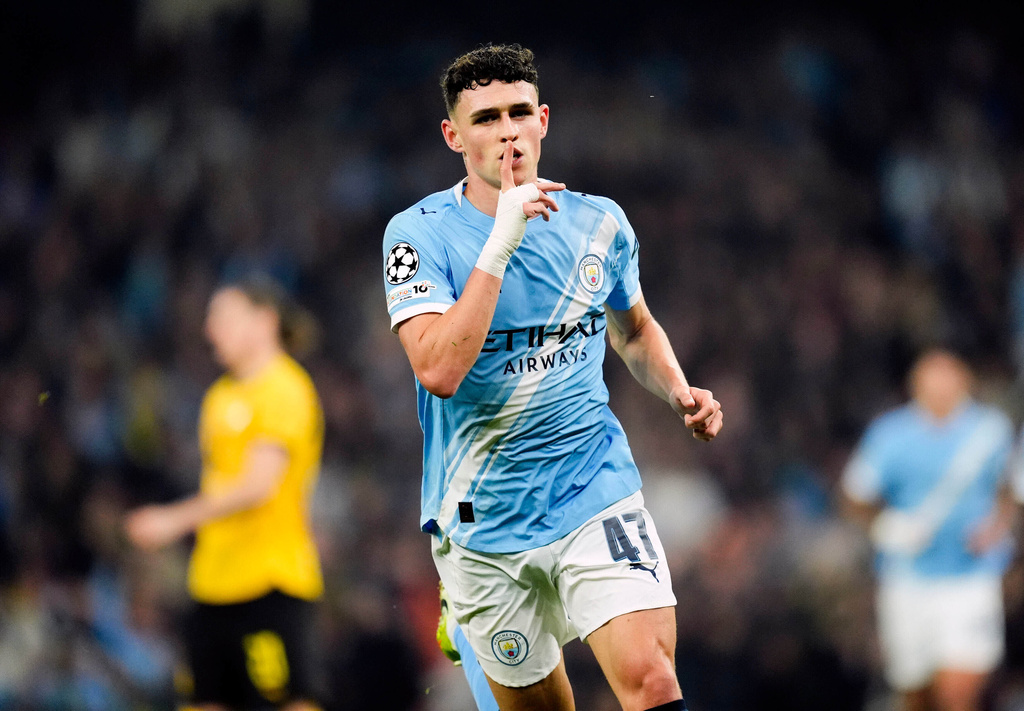 Manchester City's Phil Foden celebrates scoring the opening goal during the Champions League opening phase match against Borussia Dortmund, Wednesday, Nov. 5, 2025, in, Manchester, England. (Nick Potts/PA via AP)