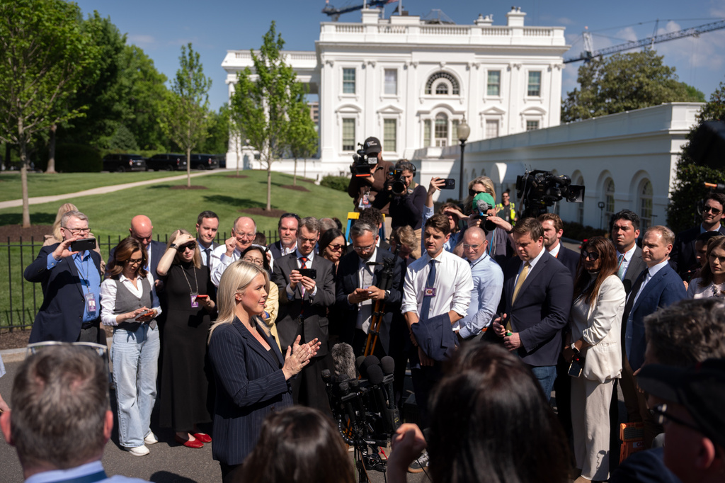 White House press secretary Karoline Leavitt speaks with reporters outside the White House, Wednesday, April 22, 2026, in Washington. (AP Photo/Mark Schiefelbein)