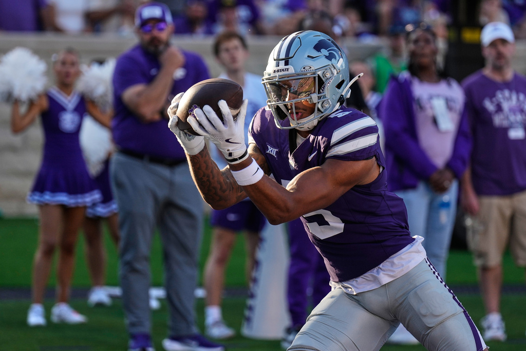 Kansas State wide receiver Jerand Bradley catches a pass in the end zone to score a touchdown during the second half of an NCAA college football game against TCU, Saturday, Oct. 11, 2025, in Manhattan, Kan. (AP Photo/Charlie Riedel)