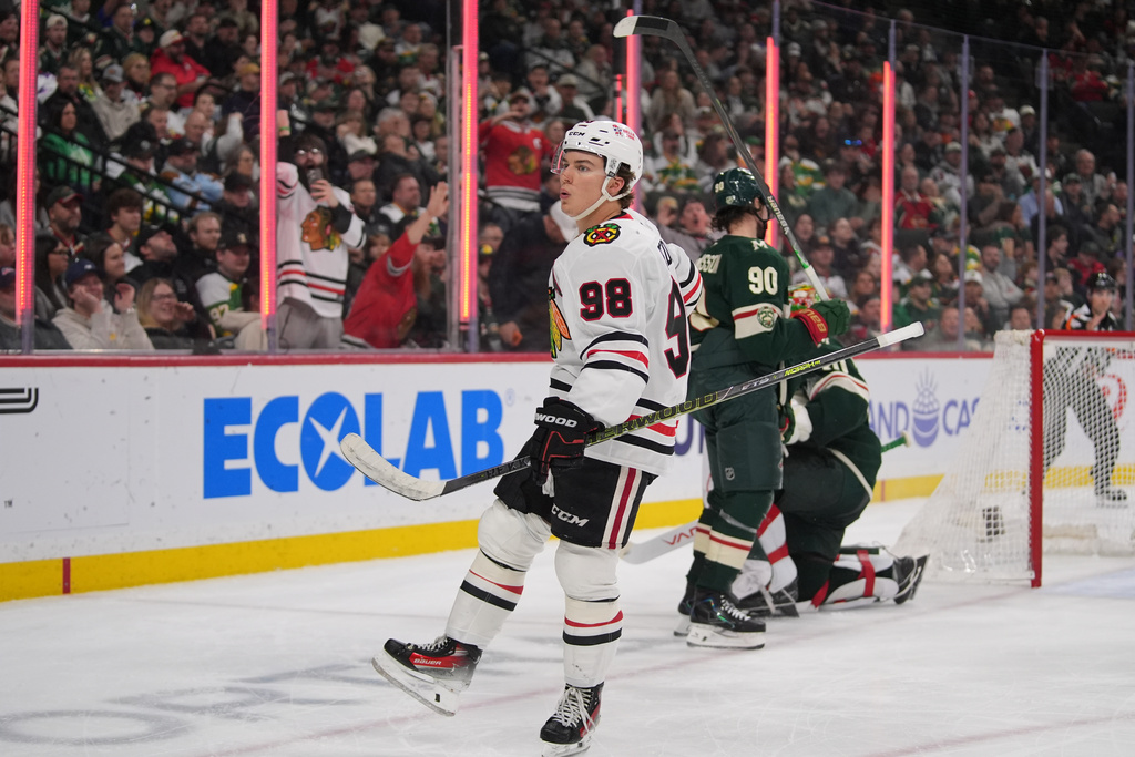 Chicago Blackhawks center Connor Bedard (98) celebrates after scoring a goal during the second period of an NHL hockey game against the Minnesota Wild, Thursday, March 19, 2026, in St. Paul, Minn. (AP Photo/Abbie Parr)