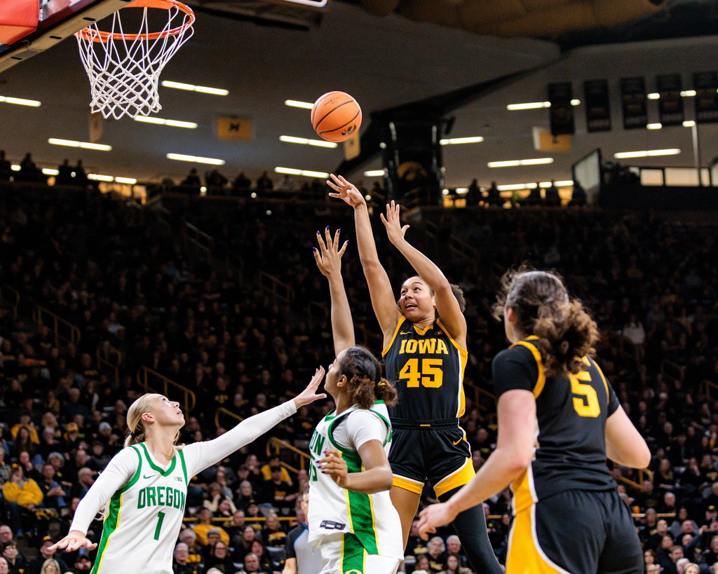 Iowa forward Hannah Stuelke (45) shoots the ball during a Big Ten conference NCAA college basketball game against Oregon in Iowa City, Iowa, Thursday, Jan. 15, 2026. (Nick Rohlman/The Gazette via AP)