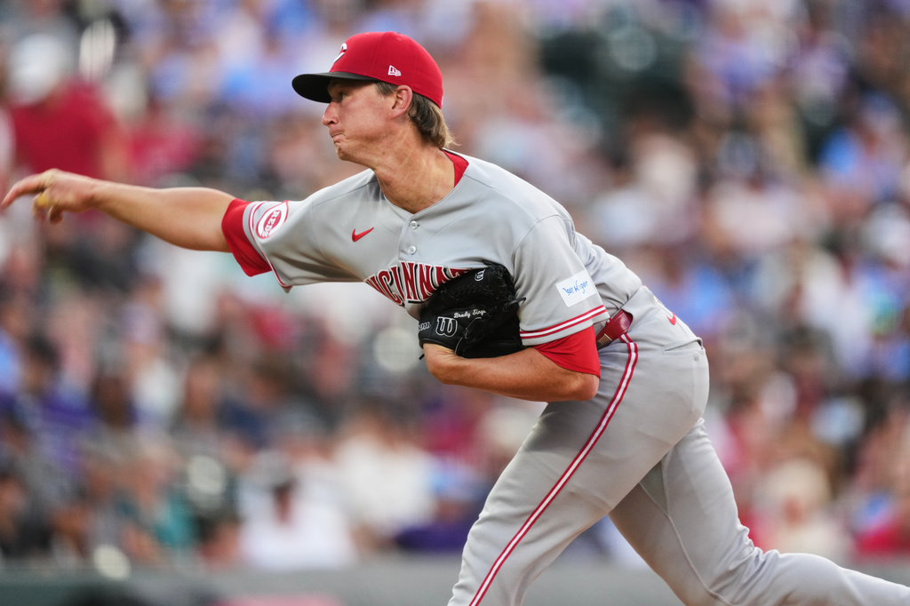 Cincinnati Reds starting pitcher Brady Singer works against the Colorado Rockies in the first inning of a baseball game Friday, July 17, 2026, in Denver. (AP Photo/David Zalubowski)