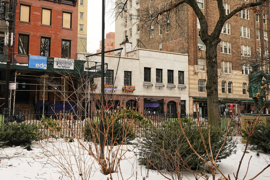 The Trump administration has stopped flying a rainbow flag on the pole, center, in the Stonewall National Monument, adjacent to the Stonewall Inn, background center, in New York, Tuesday, Feb. 10, 2026. (AP Photo/Richard Drew)