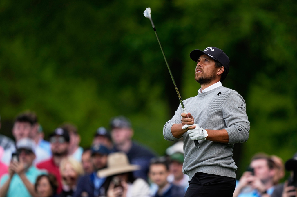 Xander Schauffele chips to the green during the first round of the PGA Championship golf tournament practice round at Aronimink Golf Club, Thursday, May 14, 2026, in Newtown Square, PA. (AP Photo/Matt Slocum)