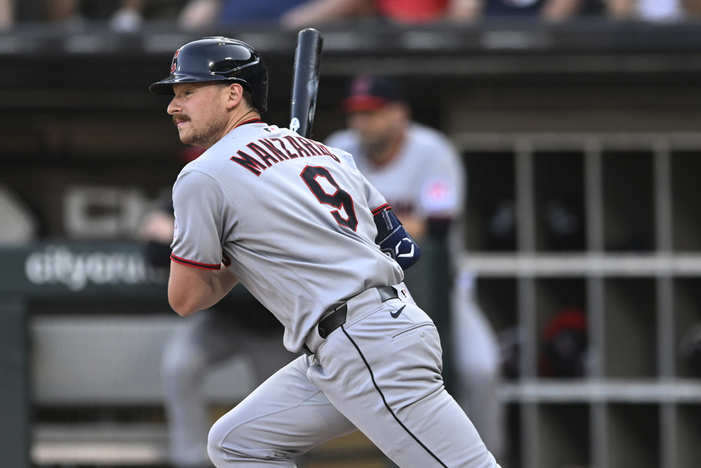 Cleveland Guardians' Kyle Manzardo watches his RBI single during the first inning of a baseball game against the Chicago White Sox, Saturday, Aug. 9, 2025, in Chicago. (AP Photo/Paul Beaty)