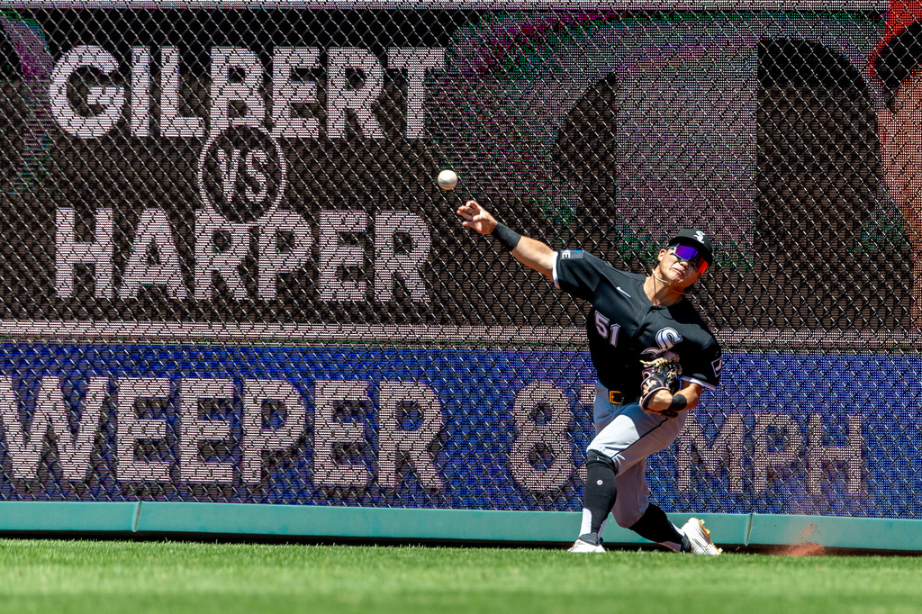 Chicago White Sox right fielder Rikuu Nishida throws to second base on a double hit by Philadelphia Phillies' Bryce Harper during the first inning of a baseball game, Sunday, June 7, 2026, in Philadelphia. (AP Photo/Laurence Kesterson)