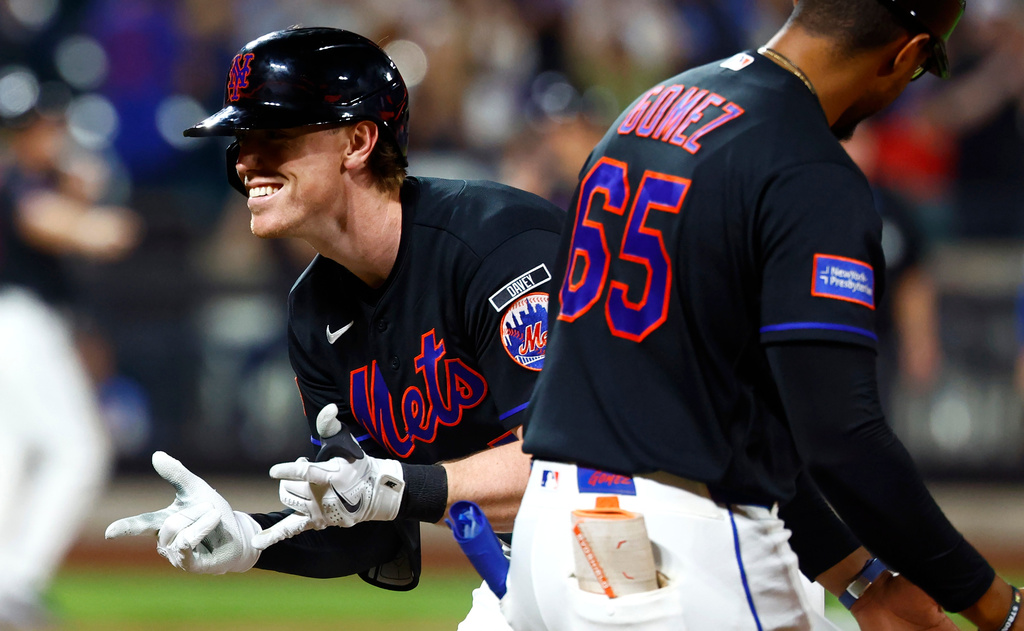 New York Mets' Brett Baty reacts after hitting an RBI single against the Kansas City Royals during the eighth inning of a baseball game, Wednesday, July 8, 2026, in New York. (AP Photo/Noah K. Murray)