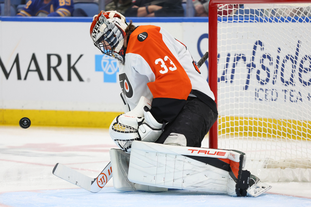 Philadelphia Flyers goaltender Samuel Ersson makes a save during the first period of an NHL hockey game against the Buffalo Sabres, Thursday, Dec. 18, 2025, in Buffalo, N.Y. (AP Photo/Jeffrey T. Barnes)