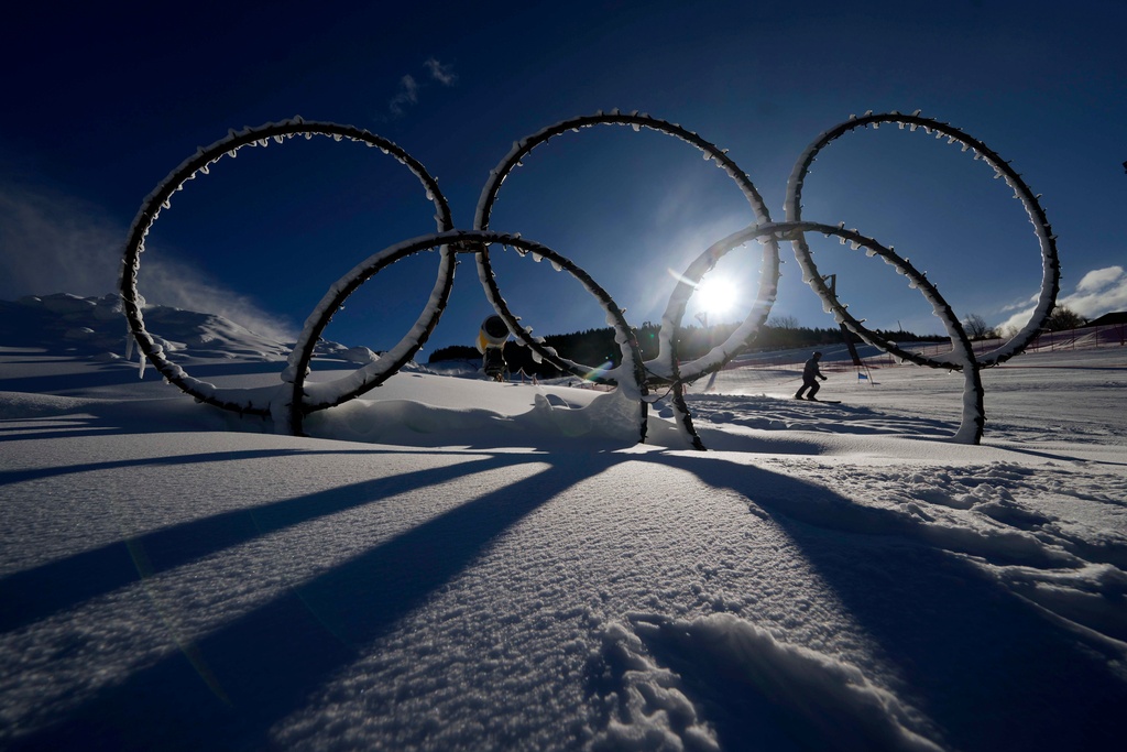 FILE - Olympic rings are displayed in the snow at the Stelvio Ski Center, venue for the alpine ski and ski mountaineering disciplines at the 2026 Milan Cortina Winter Olympics in Bormio, Italy, Jan. 16, 2025. (AP Photo/Luca Bruno, File)