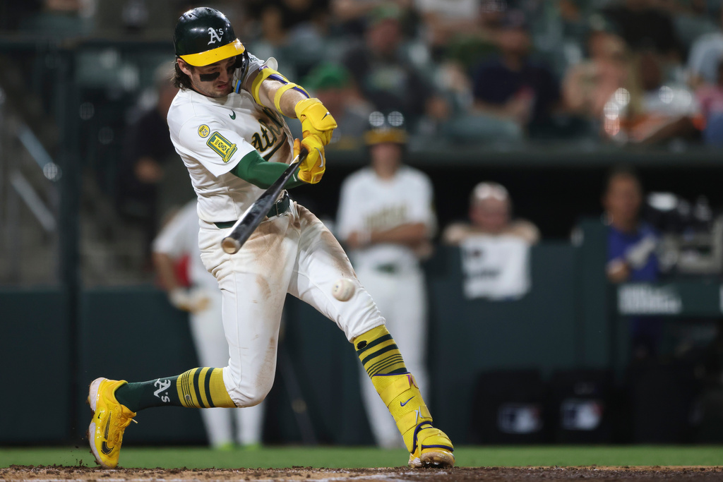 Athletics' Jacob Wilson hits an RBI single during the fifth inning of a baseball game against the Houston Astros, Tuesday, Sept. 23, 2025, in West Sacramento, Calif. (AP Photo/Scott Marshall)