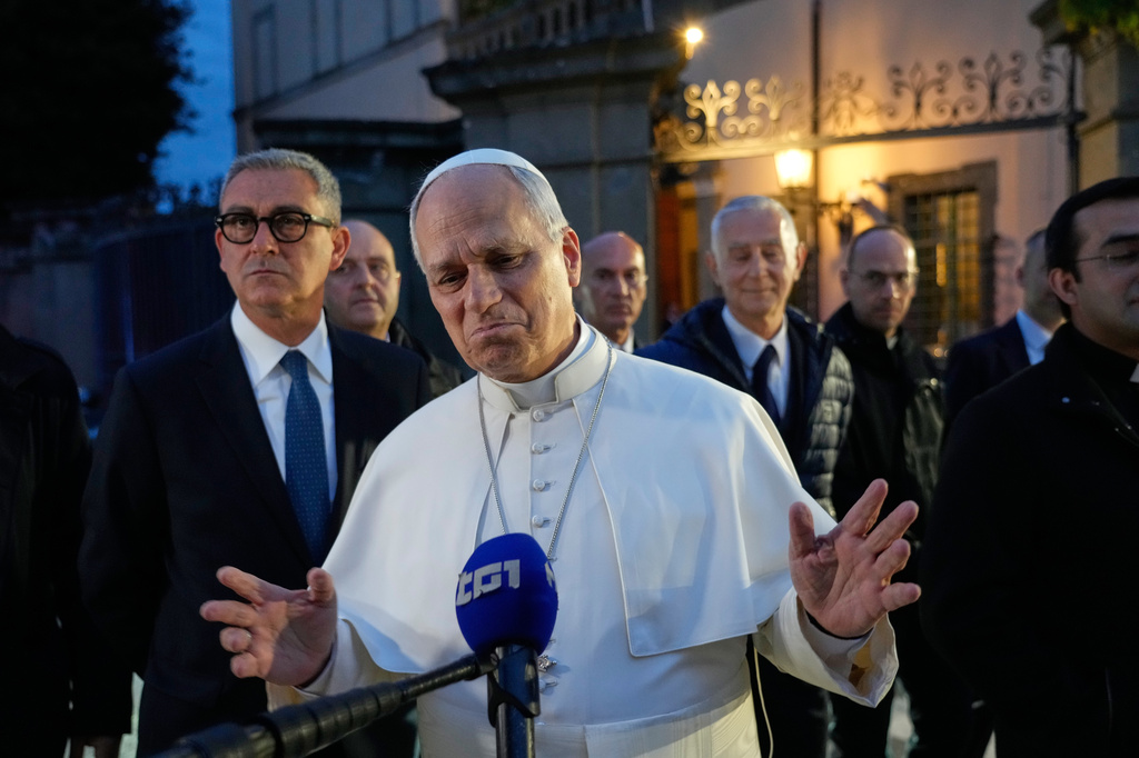 FILE - Pope Leo XIV talks to journalists as he leaves his residence in Castel Gandolfo, on the outskirts of Rome, May 5, 2026. (AP Photo/Gregorio Borgia, File)
