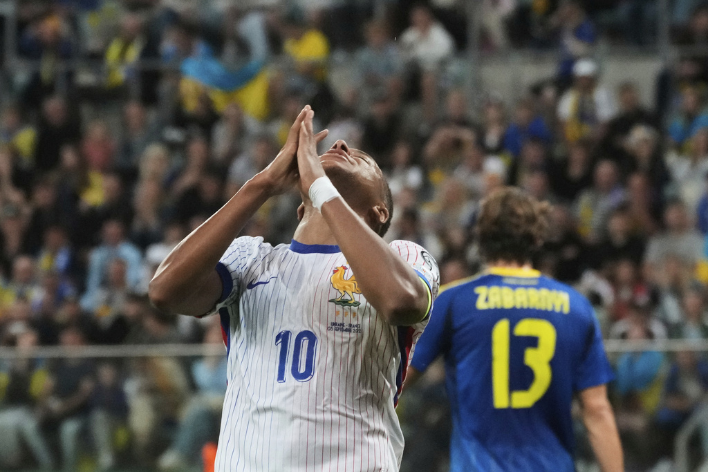 France's Kylian Mbappe reacts after missing a scoring chance during the 2026 FIFA World Cup qualifying soccer match between Ukraine and France at Tarczynski Arena in Wroclaw, Poland, Friday, Sept. 5, 2025. (AP Photo/Czarek Sokolowski)