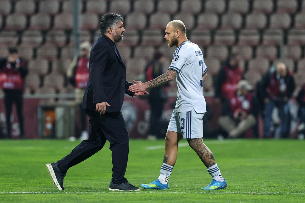 Italy coach Gennaro Gattuso greets Federico Dimarco during the World Cup qualifying playoff final soccer match between Bosnia and Italy in Zenica, Bosnia, Tuesday, March 31, 2026. (AP Photo/Armin Durgut)