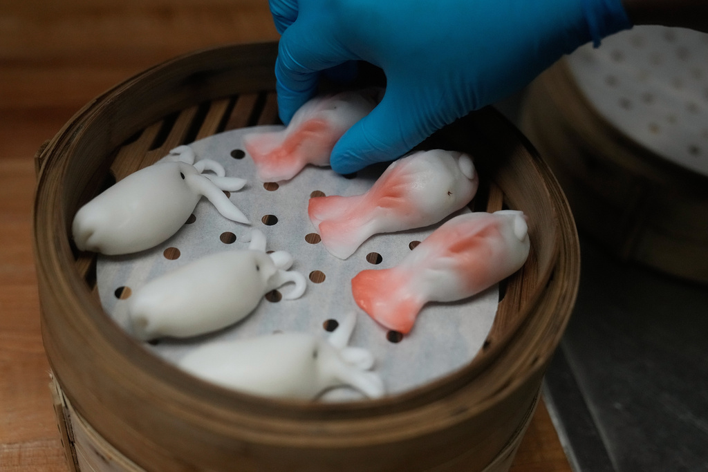 A kitchen worker prepares dumplings at the Empress by Boon restaurant in San Francisco, Thursday, Jan. 8, 2026. (AP Photo/Jeff Chiu)