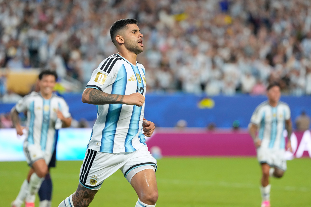 Argentina's Cristian Romero celebrates after Cape Verde's Diney Borges (3) scored an own goal during the World Cup round of 32 soccer match in Miami Gardens, Fla., Friday, July 3, 2026. (AP Photo/Rebecca Blackwell)