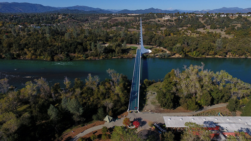 People walk across Sundial Bridge over the Sacramento River in Redding, Calif., Tuesday, Oct. 21, 2025. (AP Photo/Godofredo A. Vásquez) People walk across Sundial Bridge over the Sacramento River in Redding, Calif., Tuesday, Oct. 21, 2025. (AP Photo/Godofredo A. Vásquez)