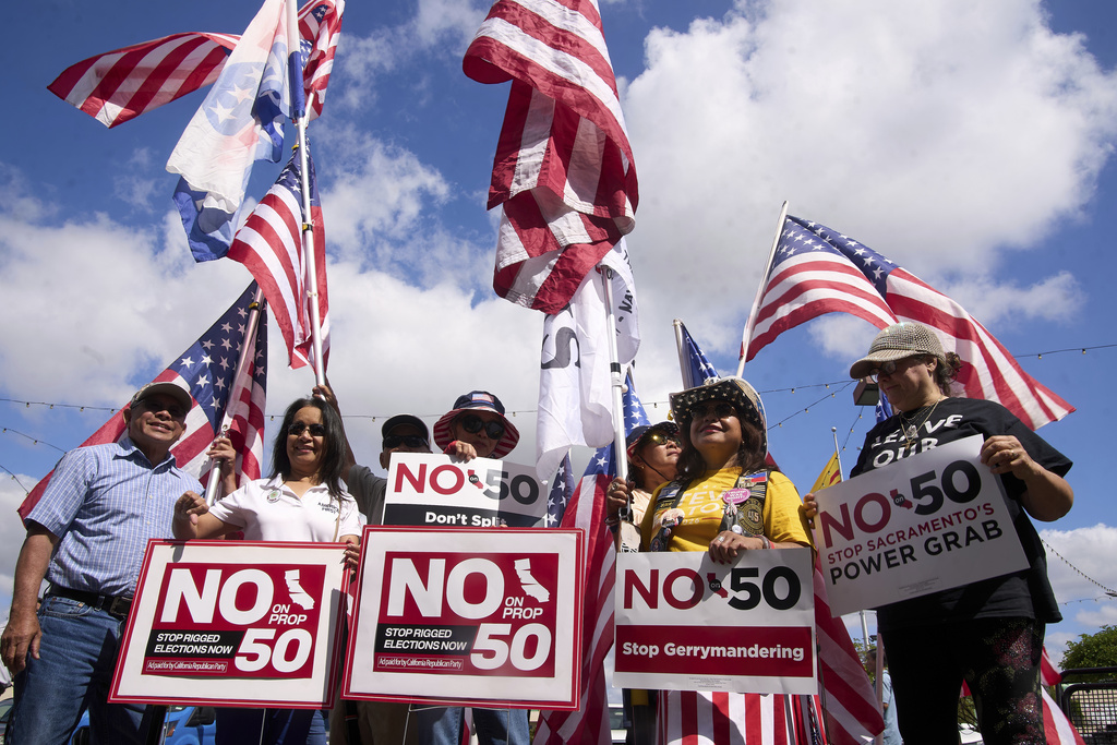 Opponents of California Proposition 50, also known as the Election Rigging Response Act, a California ballot measure that would redraw congressional maps to benefit Democrats, rally in Westminster, Calif., on Wednesday, Sept. 10, 2025. (AP Photo/Damian Dovarganes)