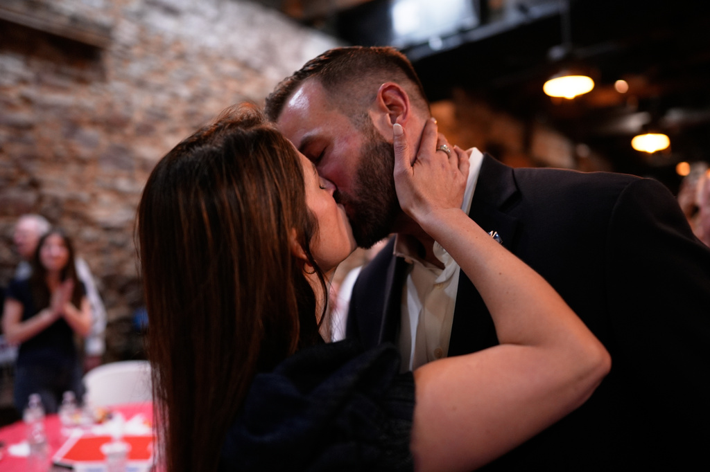 Republican candidate Clay Fuller, right, kisses his wife, Kate, as election results roll in during an election night watch party, Tuesday, April 7, 2026, in Ringgold, Ga. (AP Photo/Mike Stewart)