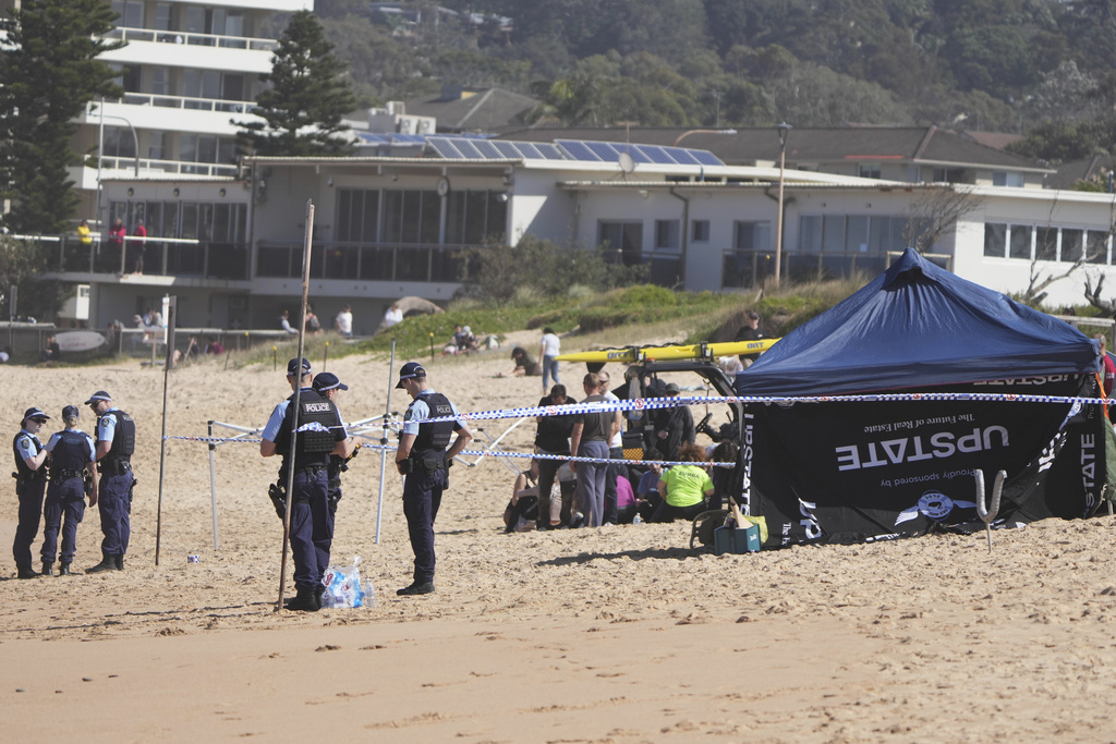 Police work at the site of a fatal shark attack at Dee Why Beach in Sydney, Australia, Saturday, Sept. 6, 2025. (AP Photo/Mark Baker)