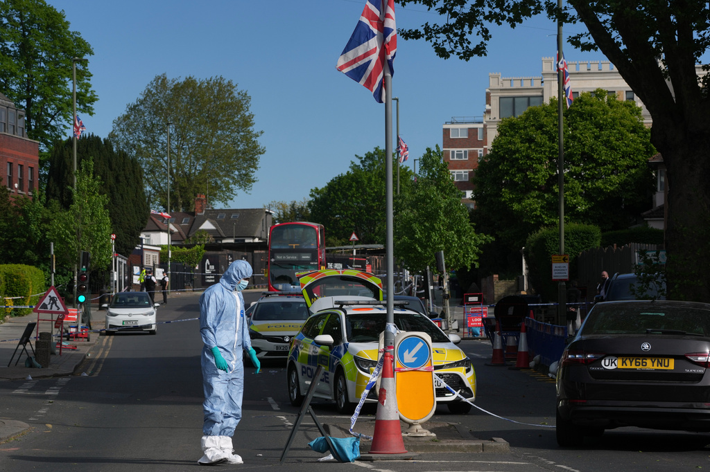 Forensic officers search the area after two people were stabbed in Golders Green neighborhood, that has a large Jewish community, in London, Wednesday, April 29, 2026.(AP Photo/Kin Cheung)