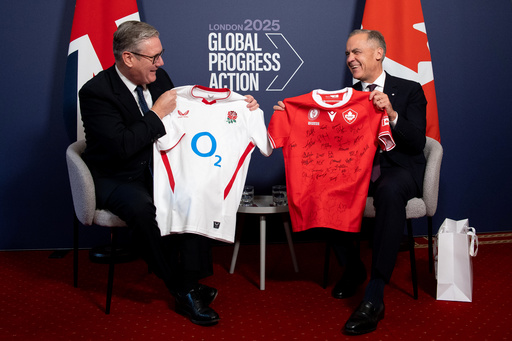 Britain's Prime Minister Keir Starmer, left, and Canada's Prime Minister Mark Carney react as they trade their nations rugby shirts ahead of the Women's Rugby World Cup Final between Canada and England, during a bilateral meeting on the sidelines of the 2025 Global Progress Action Summit in central London, Friday Sept. 26, 2025. (Niklas Halle'n/Pool Photo via AP) Britain's Prime Minister Keir Starmer, left, and Canada's Prime Minister Mark Carney react as they trade their nations rugby shirts ahead of the Women's Rugby World Cup Final between Canada and England, during a bilateral meeting on the sidelines of the 2025 Global Progress Action Summit in central London, Friday Sept. 26, 2025. (Niklas Halle'n/Pool Photo via AP)