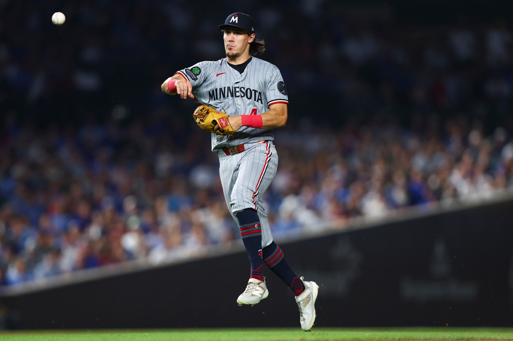 Minnesota Twins shortstop Tristan Gray throws to first base during the sixth inning of a baseball game against the Chicago Cubs in Chicago, Friday, July 17, 2026. (AP Photo/Jessie Alcheh)