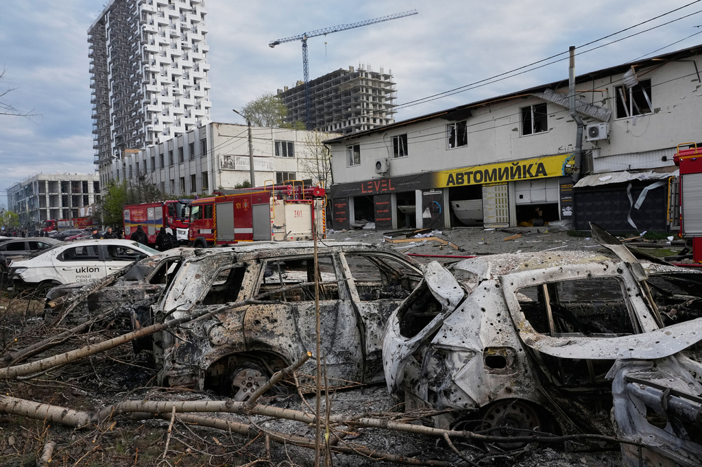 Burnt private cars on a damaged parking site following Russia's missile attack in Kyiv, Ukraine, Thursday, April 16, 2026. (AP Photo/Efrem Lukatsky)