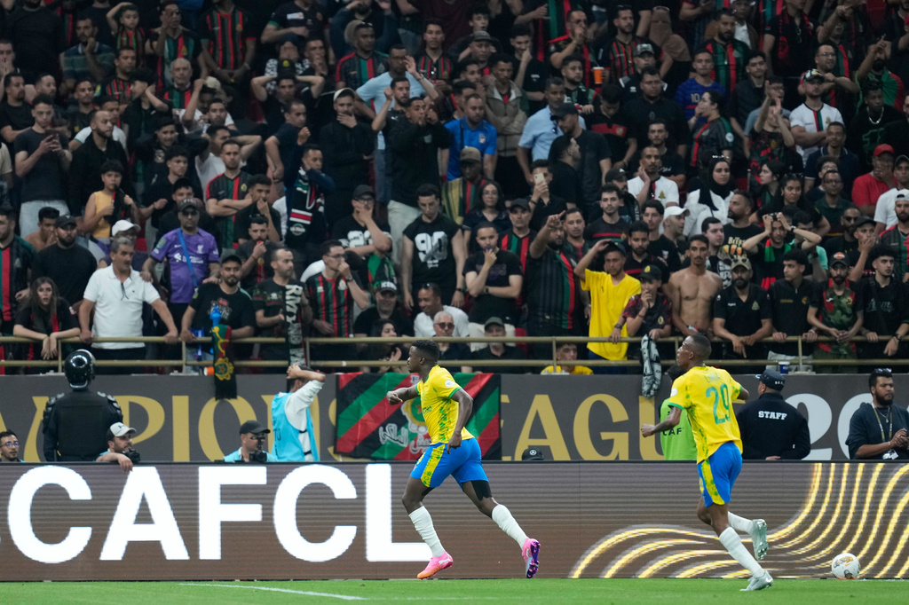 Mamelodi Sundowns' Teboho Mokoena, center, celebrates scoring his side's opening goal during the CAF Champions League final soccer match between AS FAR Rabat and Mamelodi Sundowns, in Rabat, Morocco, Sunday, May 24, 2026. (AP Photo/Mosa'ab Elshamy)