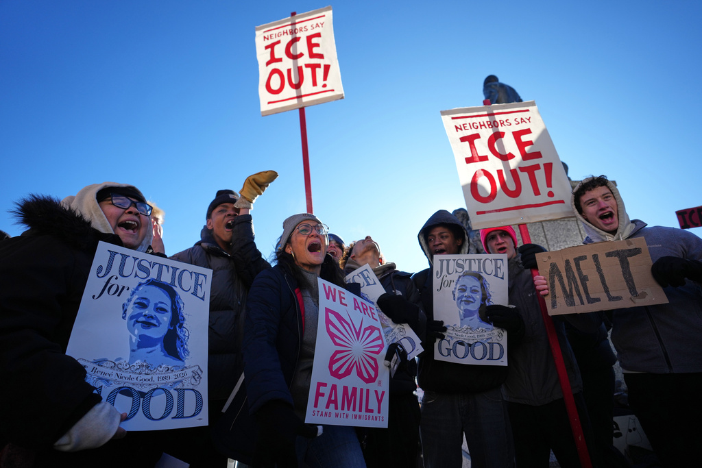 Protesters gather in front of the Minnesota State Capitol in response to the death of Renee Good, who was fatally shot by an ICE officer last week, Wednesday, Jan. 14, 2026, in St. Paul, Minn. (AP Photo/Abbie Parr)