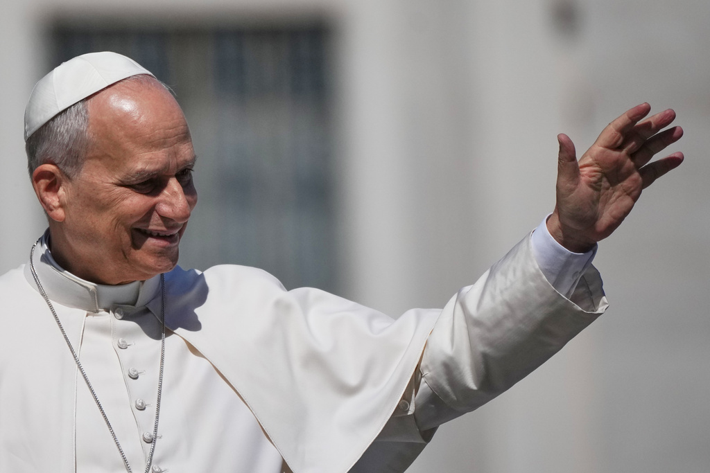 Pope Leo XIV greets faithful as he leaves at the end of the weekly general audience in St. Peter's Square, at the Vatican, Wednesday, March 25, 2026. (AP Photo/Alessandra Tarantino)