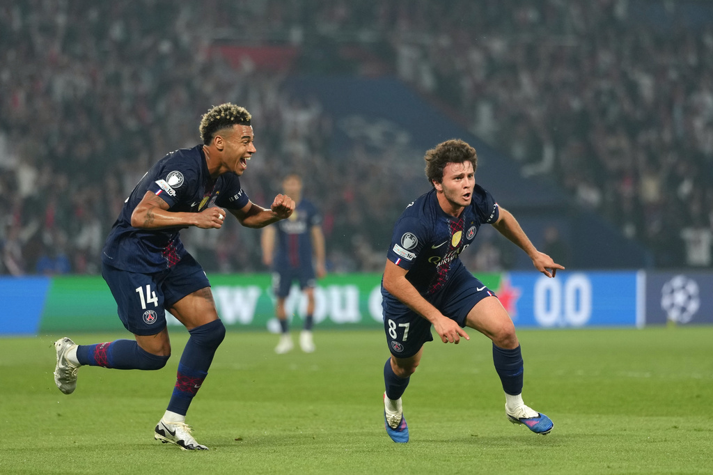 PSG's Joao Neves, right, celebrates after scoring his side's second goal during a Champions League semifinal, first leg, soccer match between Paris Saint-Germain and Bayern Munich in Paris, Tuesday, April 28, 2026. (AP Photo/Aurelien Morissard)
