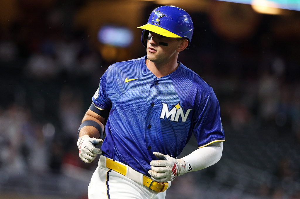 Minnesota Twins' Brooks Lee reacts runs the bases on his go-ahead solo home run against the St. Louis Cardinals during the eighth inning of a baseball game, Friday, June 12, 2026, in Minneapolis. (AP Photo/Matt Krohn)