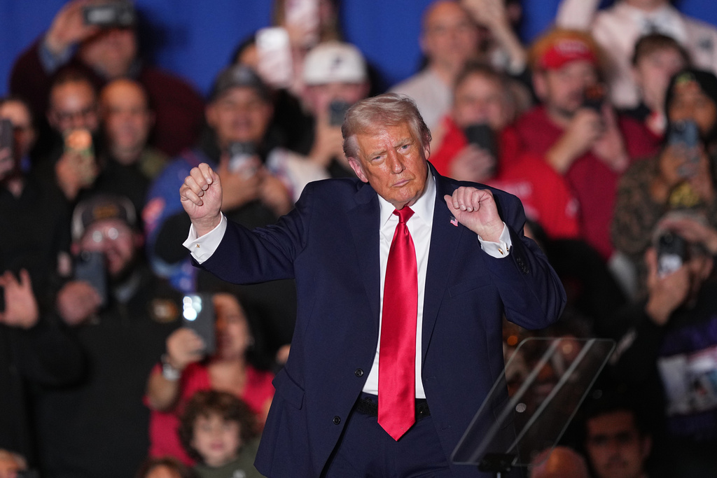 President Donald Trump dances to music after speaking at the Mount Airy Casino Resort in Mount Pocono, Pa., Tuesday, Dec. 9, 2025. (AP Photo/Matt Rourke)