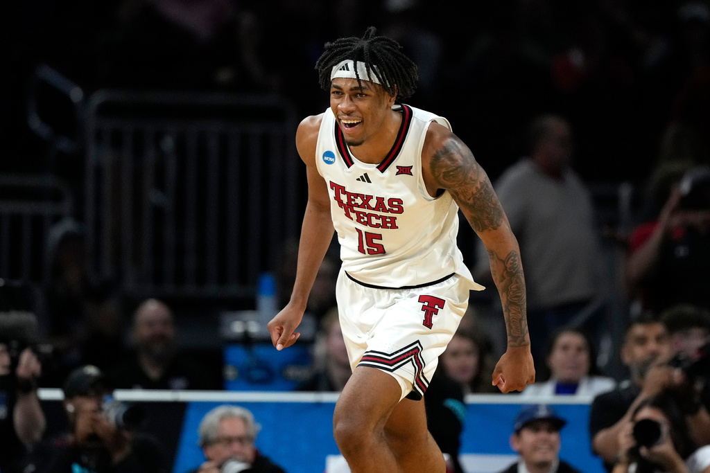 FILE - Texas Tech forward JT Toppin celebrates after scoring a basket during the second half against UNC Wilmington in the first round of the NCAA college basketball tournament, March 21, 2025, in Wichita, Kan. (AP Photo/Charlie Riedel, file)