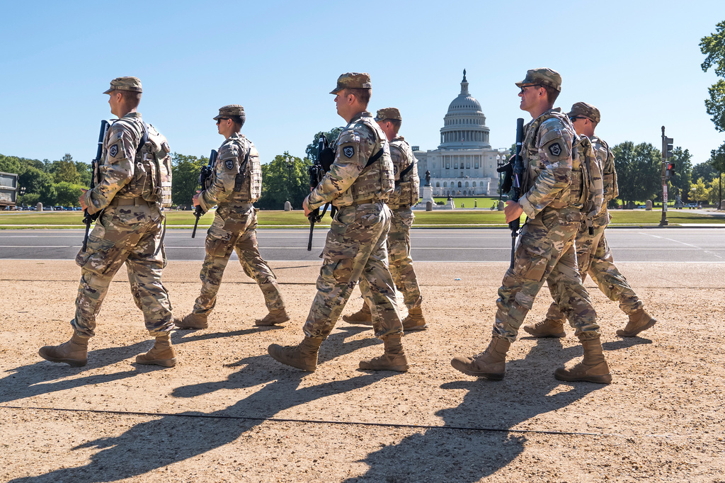FILE - Armed National Guard soldiers from West Virginia patrol the Mall near the Capitol in Washington, as part of President Donald Trump's order to impose federal law enforcement in the nation's capital, Aug. 26, 2025. (AP Photo/J. Scott Applewhite, File)