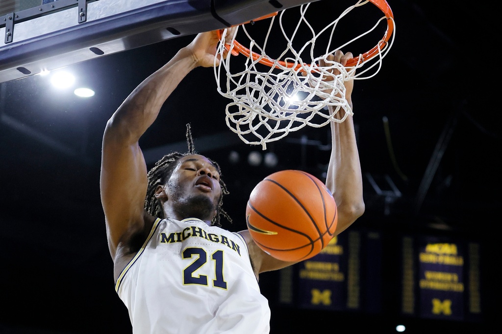 Michigan forward Morez Johnson Jr. dunks against Rutgers during the second half of an NCAA college basketball game Saturday, Dec. 6, 2025, in Ann Arbor, Mich. (AP Photo/Duane Burleson)
