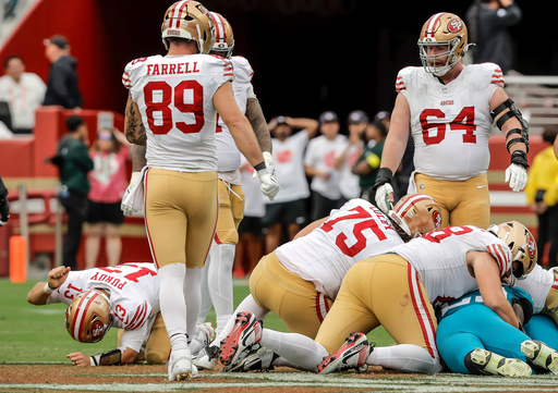 San Francisco 49ers' Brock Purdy (13), lower left, pounds his fist into the turf after his fumble in the final minutes of an NFL football game was recovered by the Jacksonville Jaguars in Santa Clara, Calif., Sunday, Sept. 28, 2025. (Carlos Avila Gonzalez/San Francisco Chronicle via AP) San Francisco 49ers' Brock Purdy (13), lower left, pounds his fist into the turf after his fumble in the final minutes of an NFL football game was recovered by the Jacksonville Jaguars in Santa Clara, Calif., Sunday, Sept. 28, 2025. (Carlos Avila Gonzalez/San Francisco Chronicle via AP)