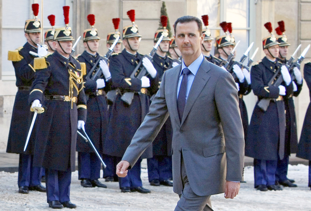 FILE - In this Dec. 9, 2010 file photo, Syria President Bashar al-Assad arrives at the Elysee Palace in Paris for his meeting with French President Nicolas Sarkozy. (AP Photo/Remy de la Mauviniere, File)